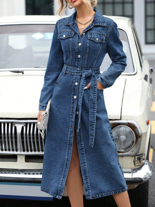 Blue denim long-sleeve belted dress with front button placket and wrap waist tie.