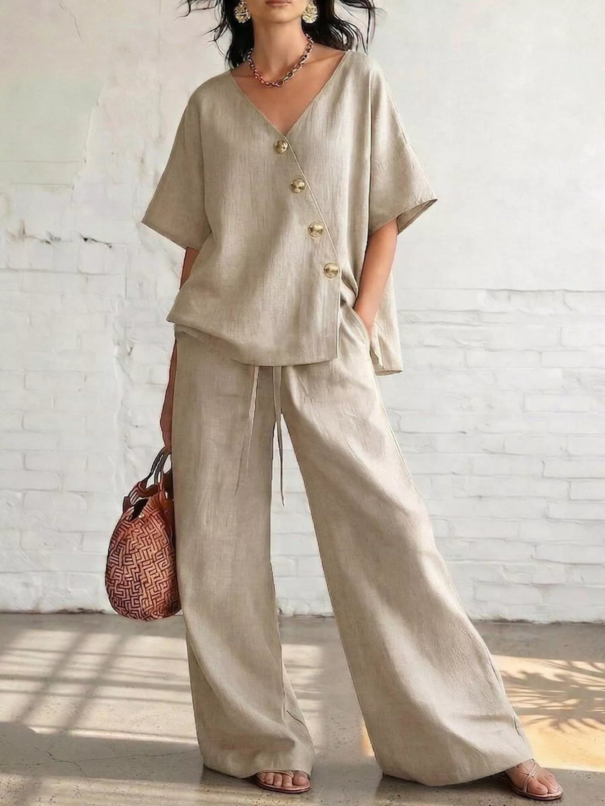 Beige surplice half-sleeve top with gold buttons and wide-leg pants set