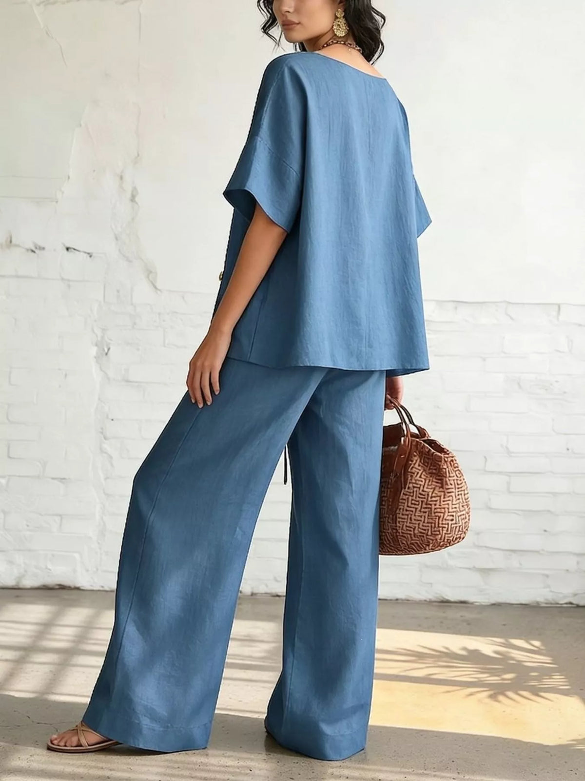 Blue surplice top and wide-leg pants set, short-sleeve back view