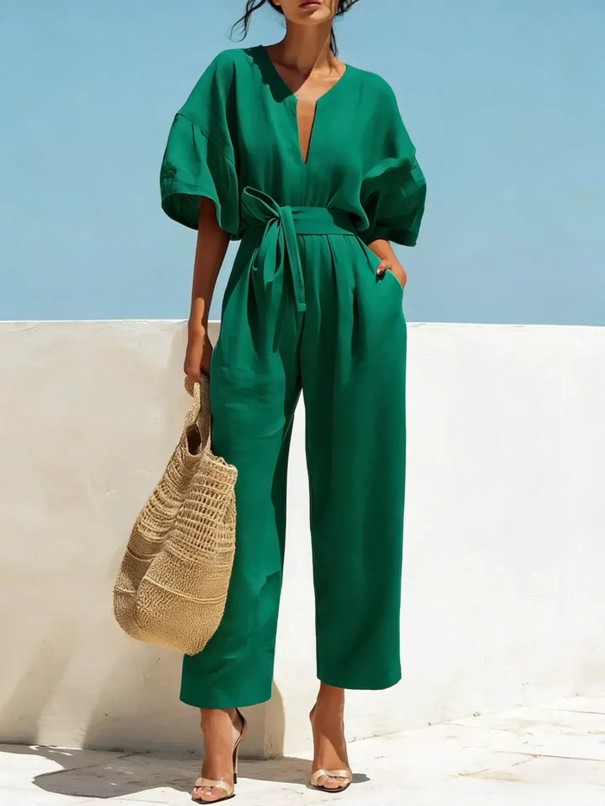 Green tie-waist wide-leg jumpsuit with V-neck and short puff sleeves