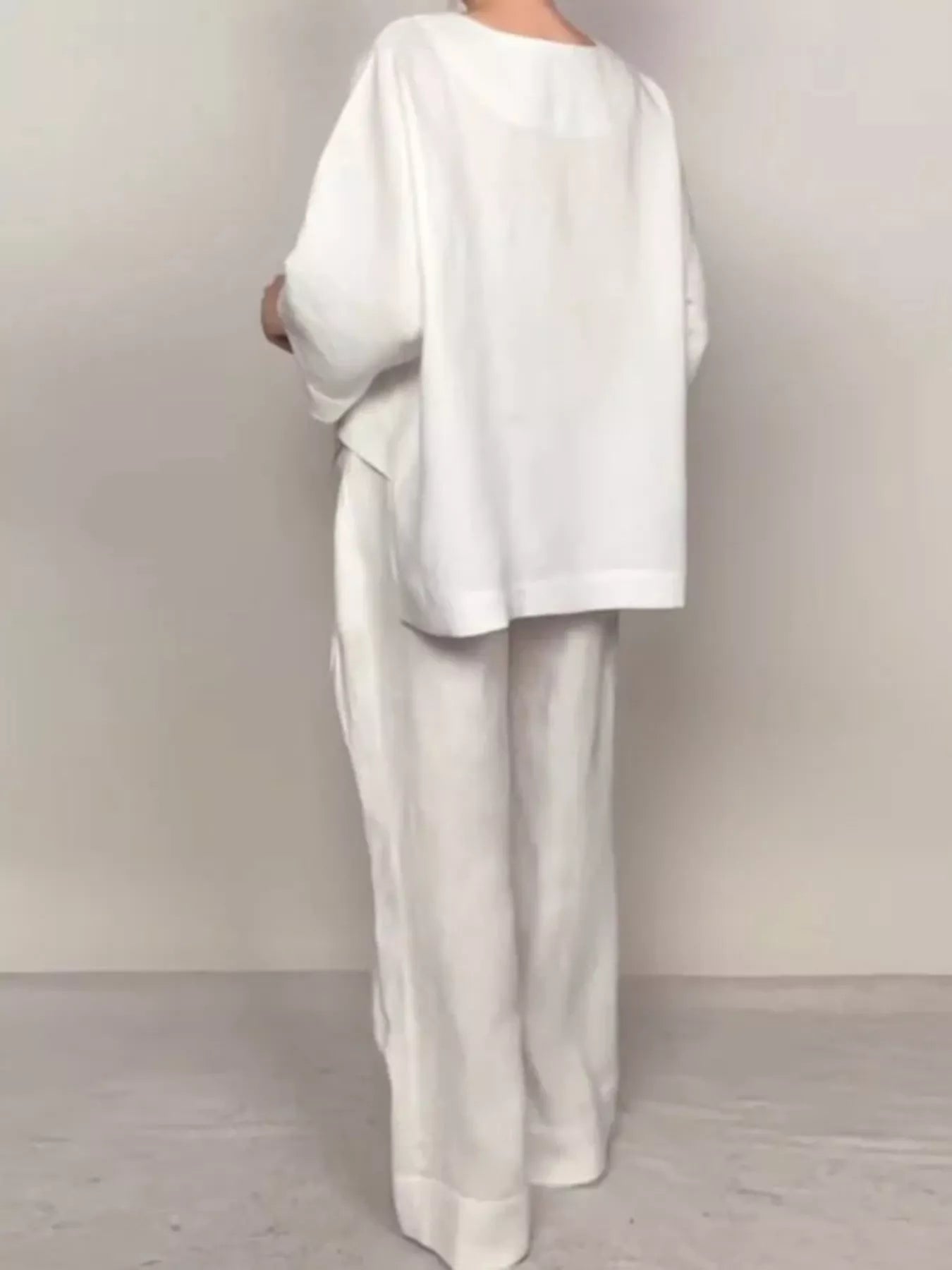 White V-neck long sleeve top and wide-leg pants set, shown from the back.