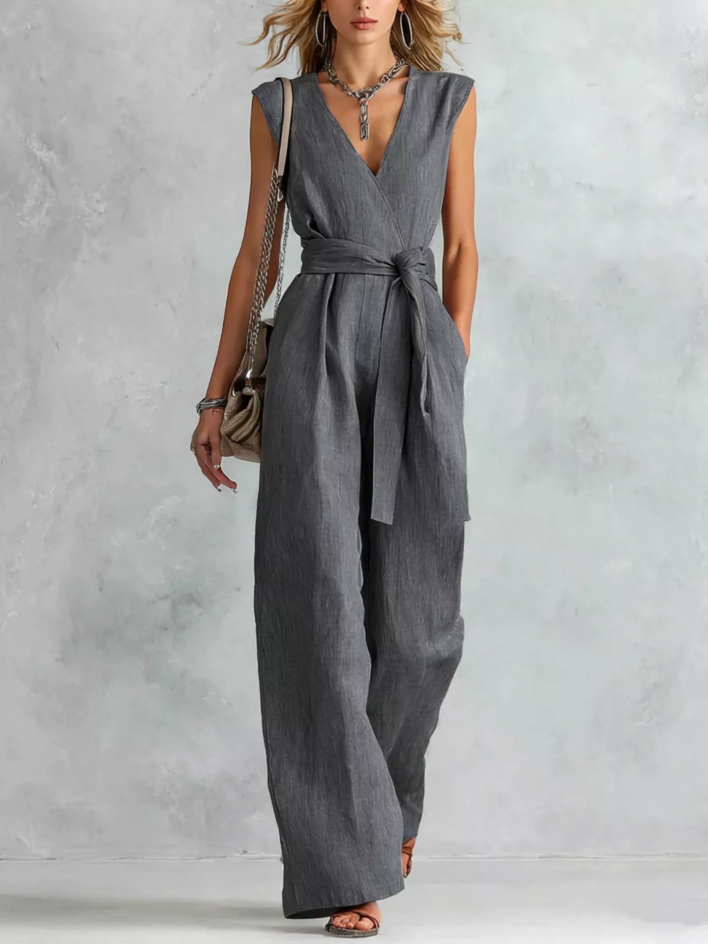 Sleeveless wide-leg jumpsuit in dark gray with V-neck and tied waist