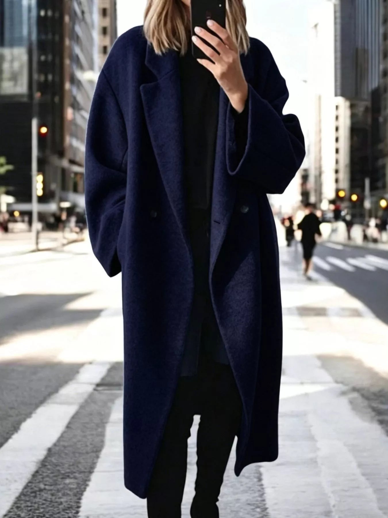 Navy longline wool-blend coat with notch lapels and double-breasted button front