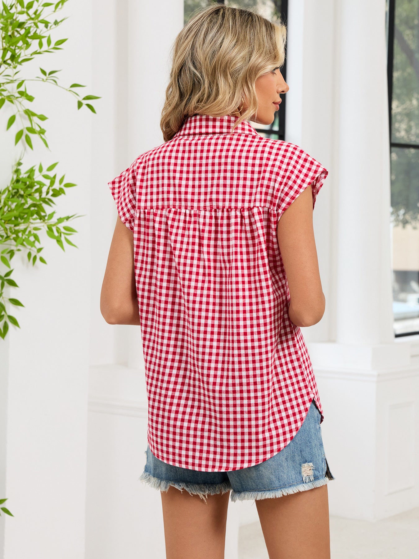 Red and white plaid cap sleeve button-up shirt, back view with collar