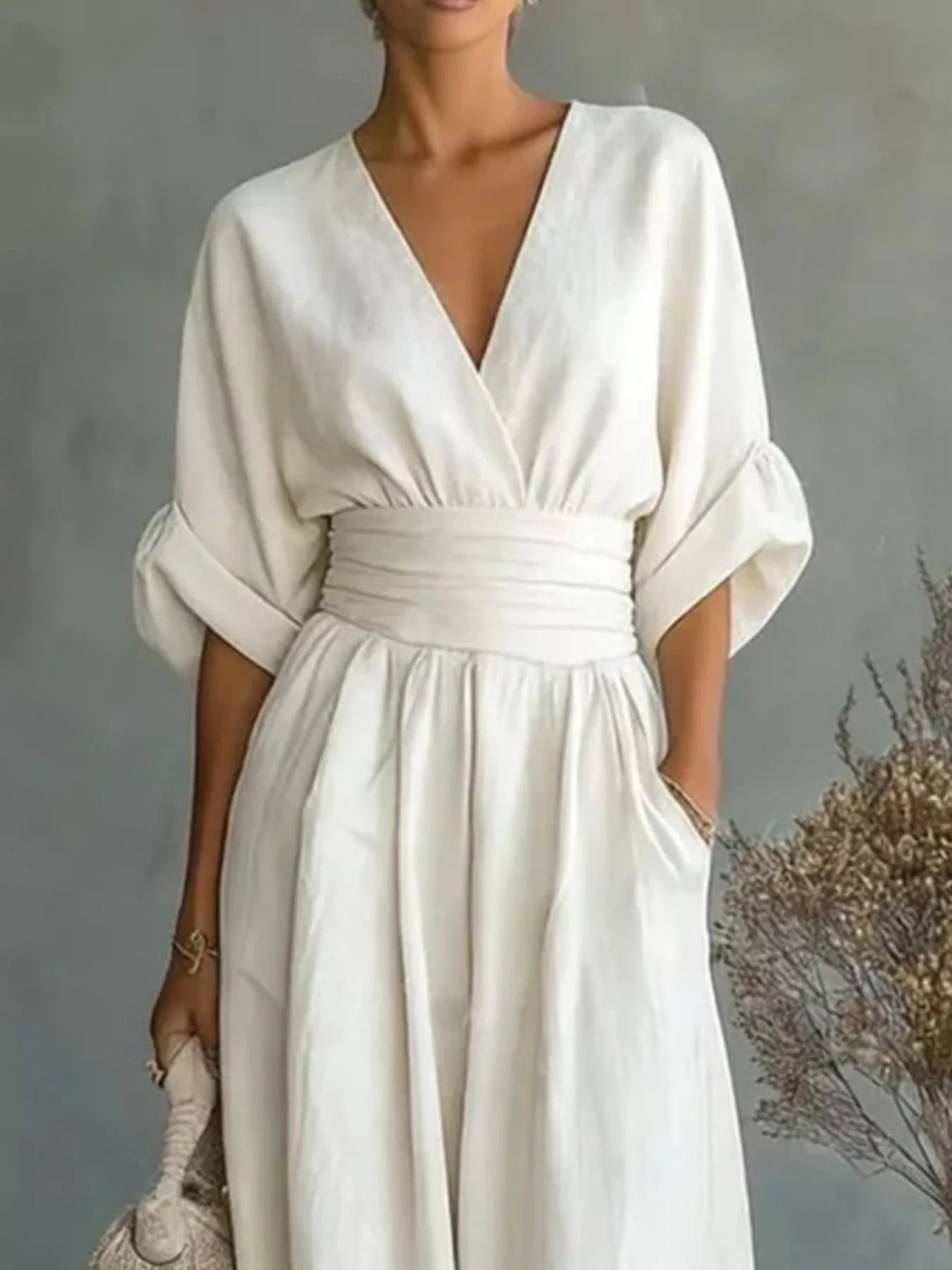 White plus size jumpsuit with V-neck and half sleeves, gathered waist, wide legs