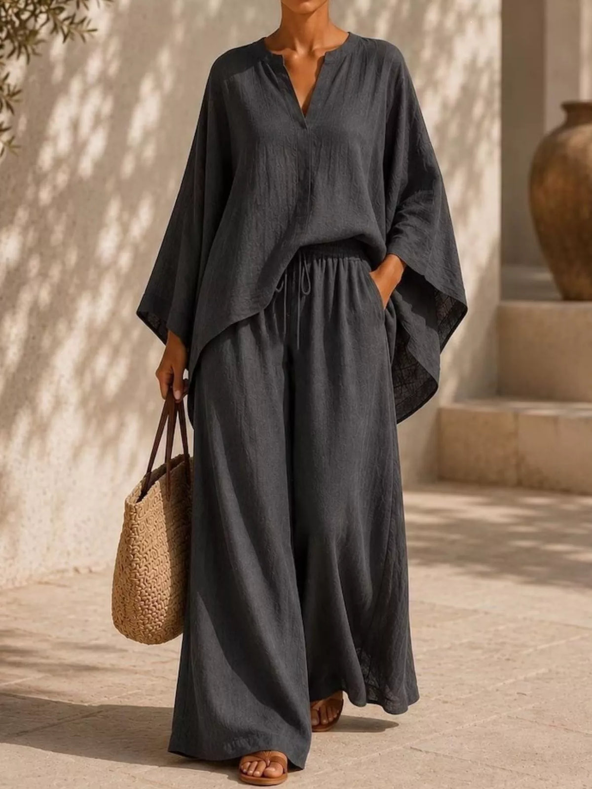 Plus-size notched long-sleeve top and wide-leg pants set in dark gray, drawstring waist