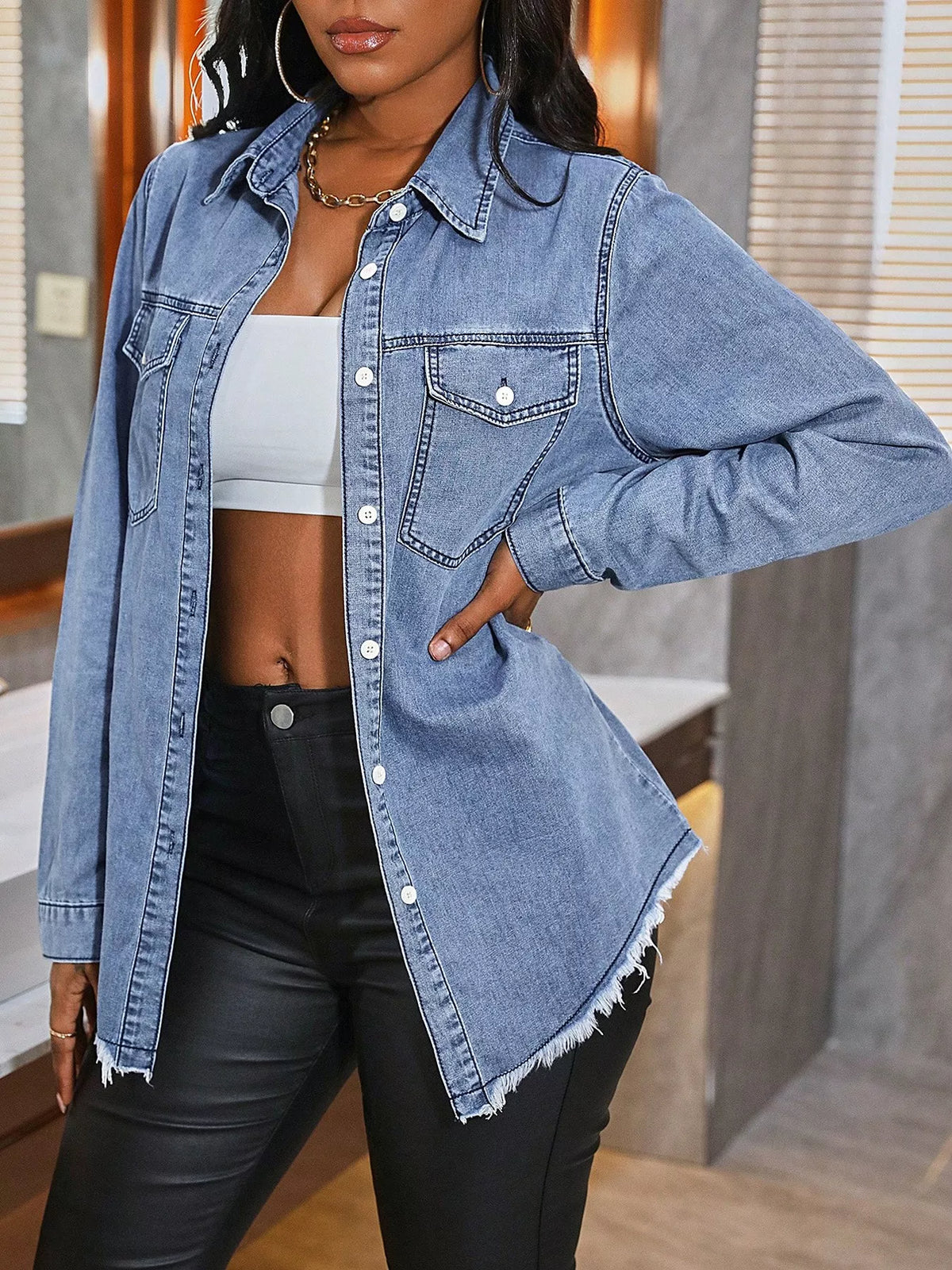 Light-wash raw-hem denim shirt, button front, chest flap pockets, pointed collar