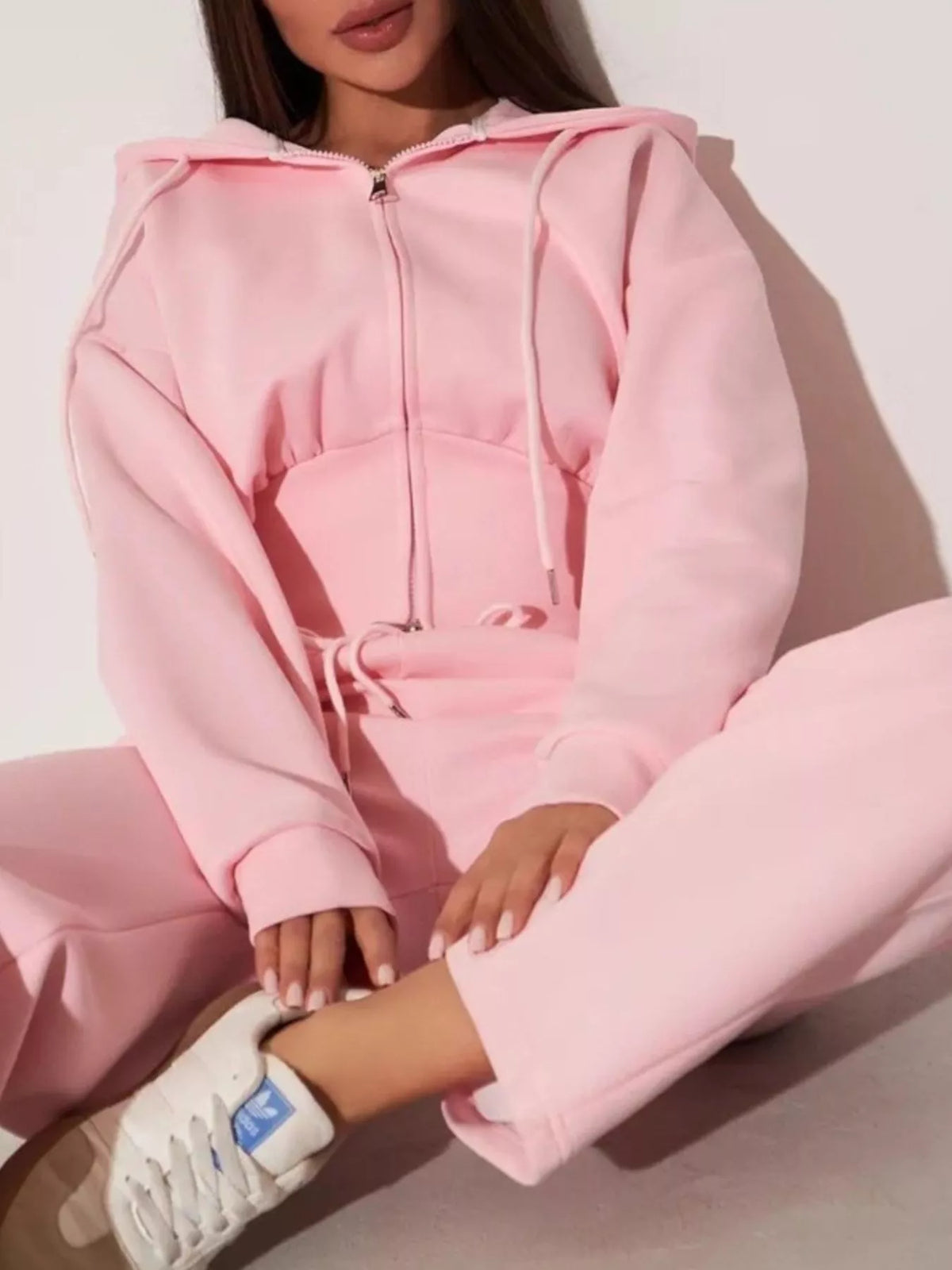 Pink zip-up hoodie and wide-leg pants set with hood, drawstring waist, and long sleeves