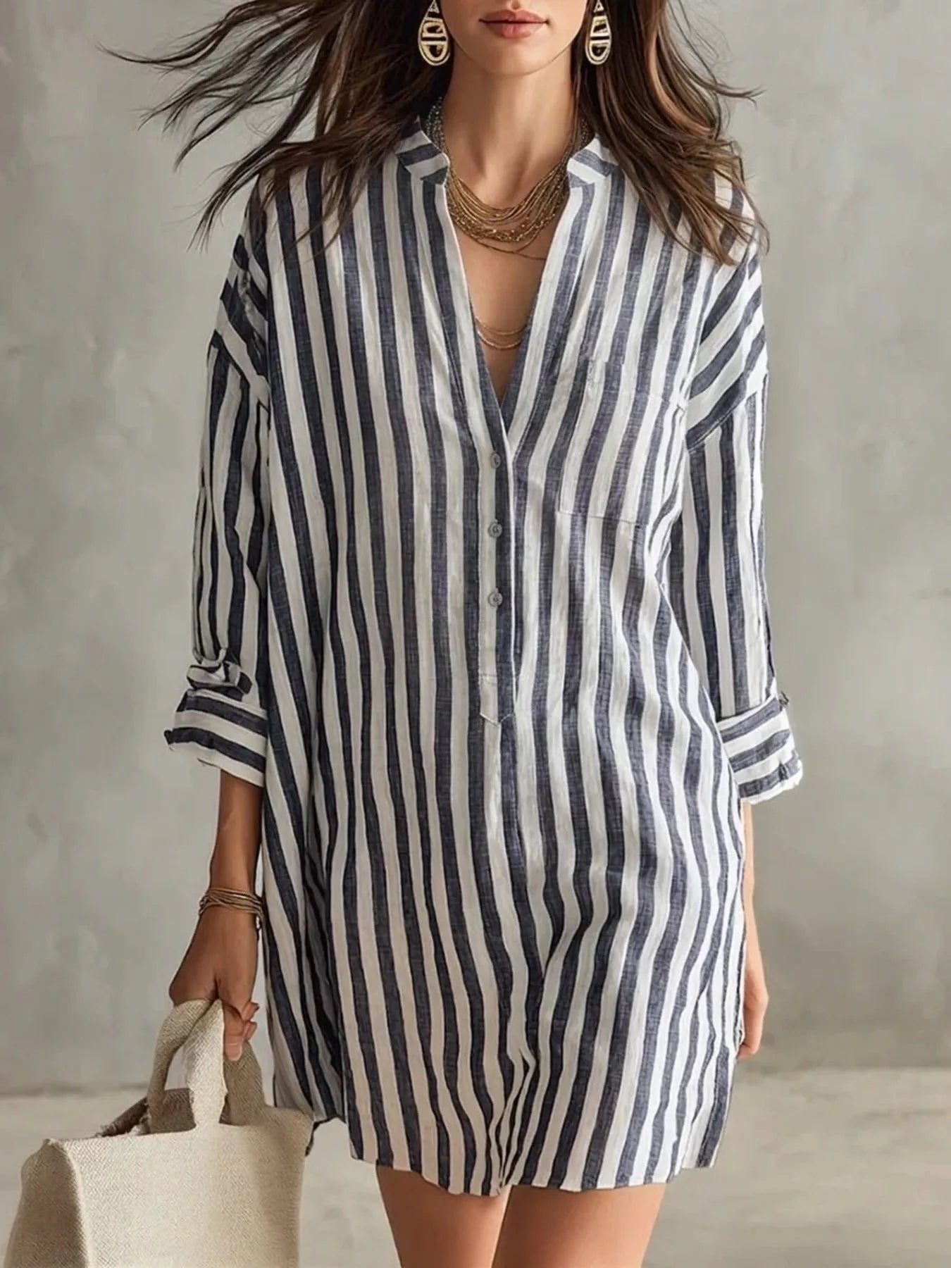 Black-and-white striped shirt dress with 3/4 sleeves, button front, V-neck, chest pocket