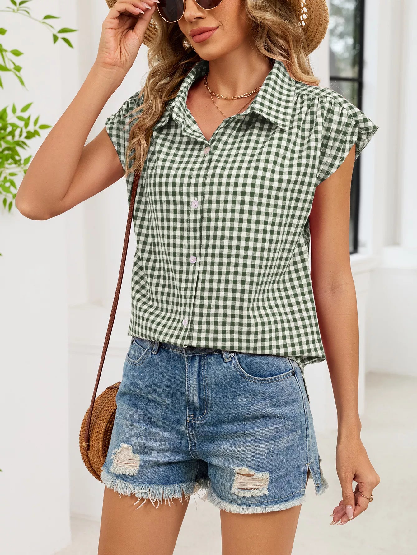Green-and-white plaid cap-sleeve button-up shirt with collar and button front