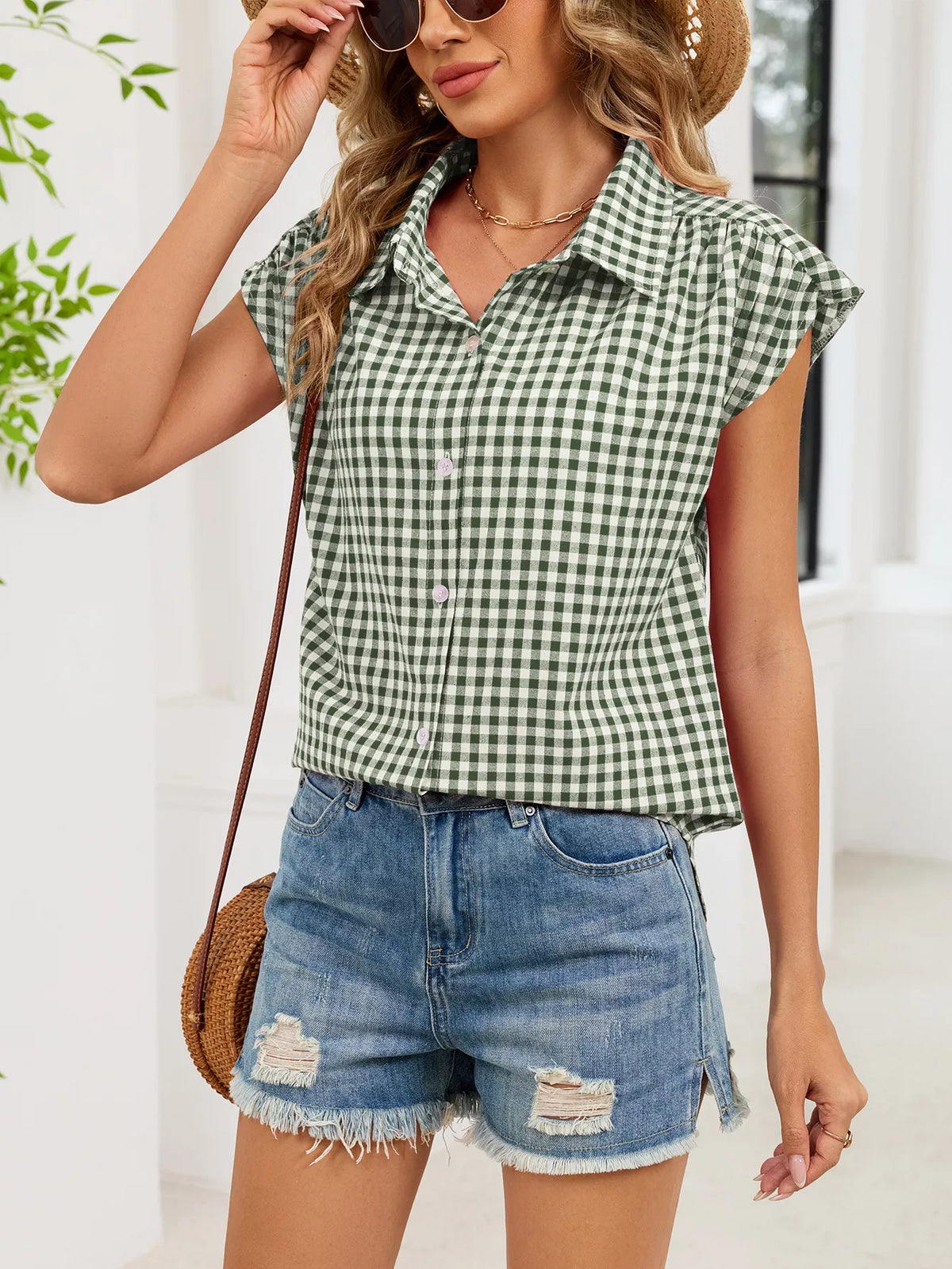 Green-and-white plaid cap-sleeve button-up shirt with collar and button front