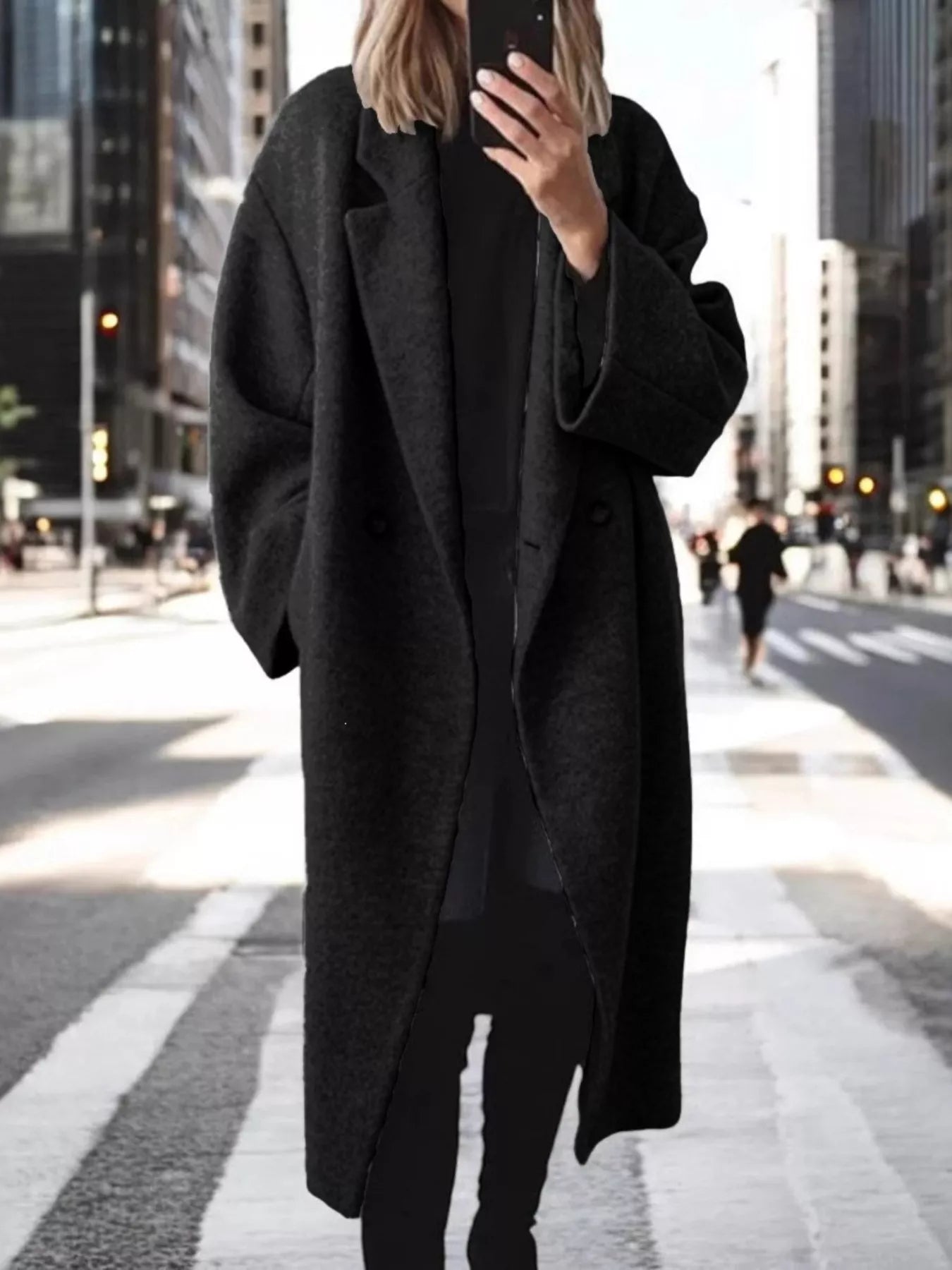 Black longline wool-blend coat with notch lapels and double-breasted button front