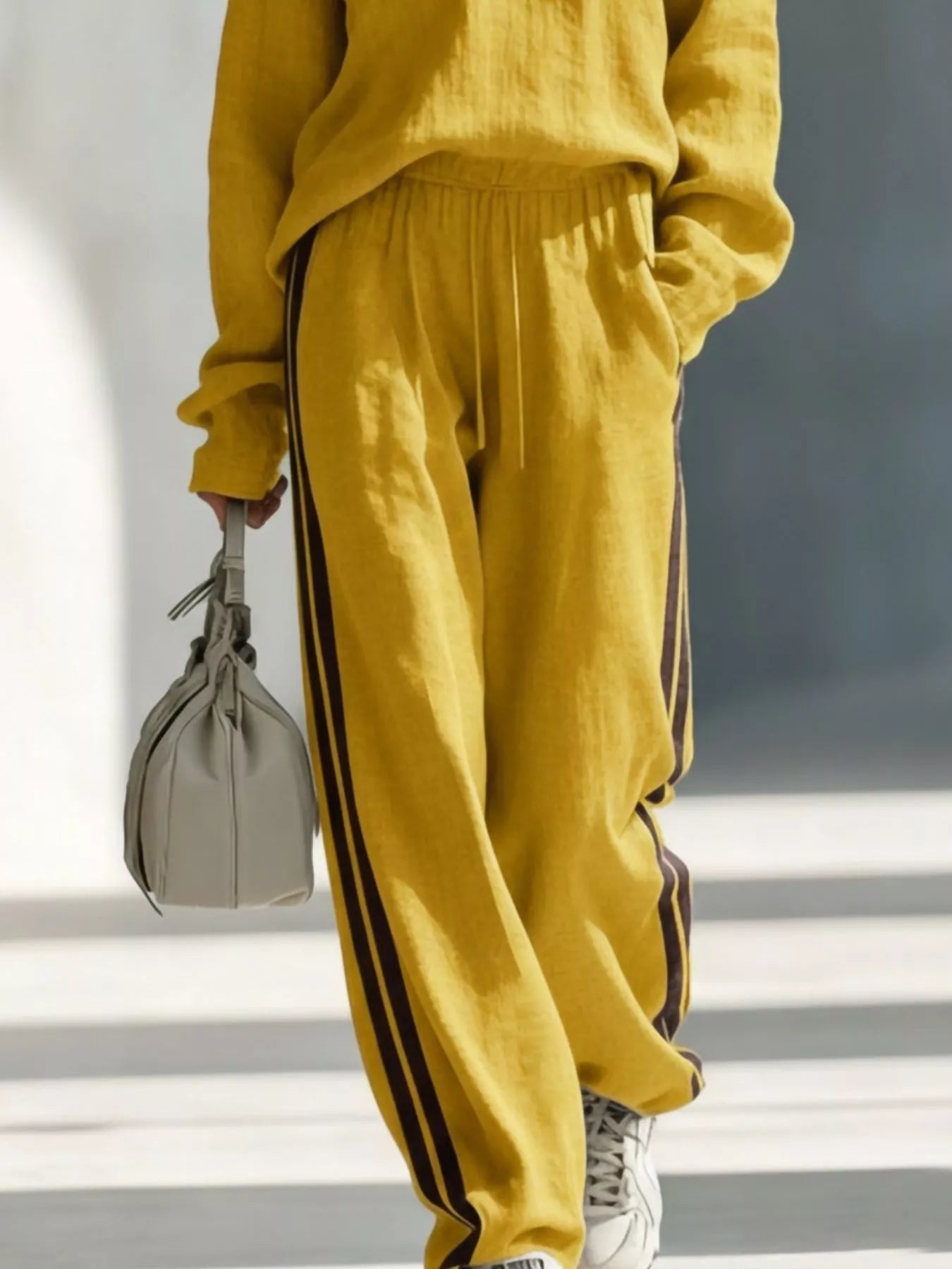 Yellow V-neck top and striped jogger pants set with side stripe accents