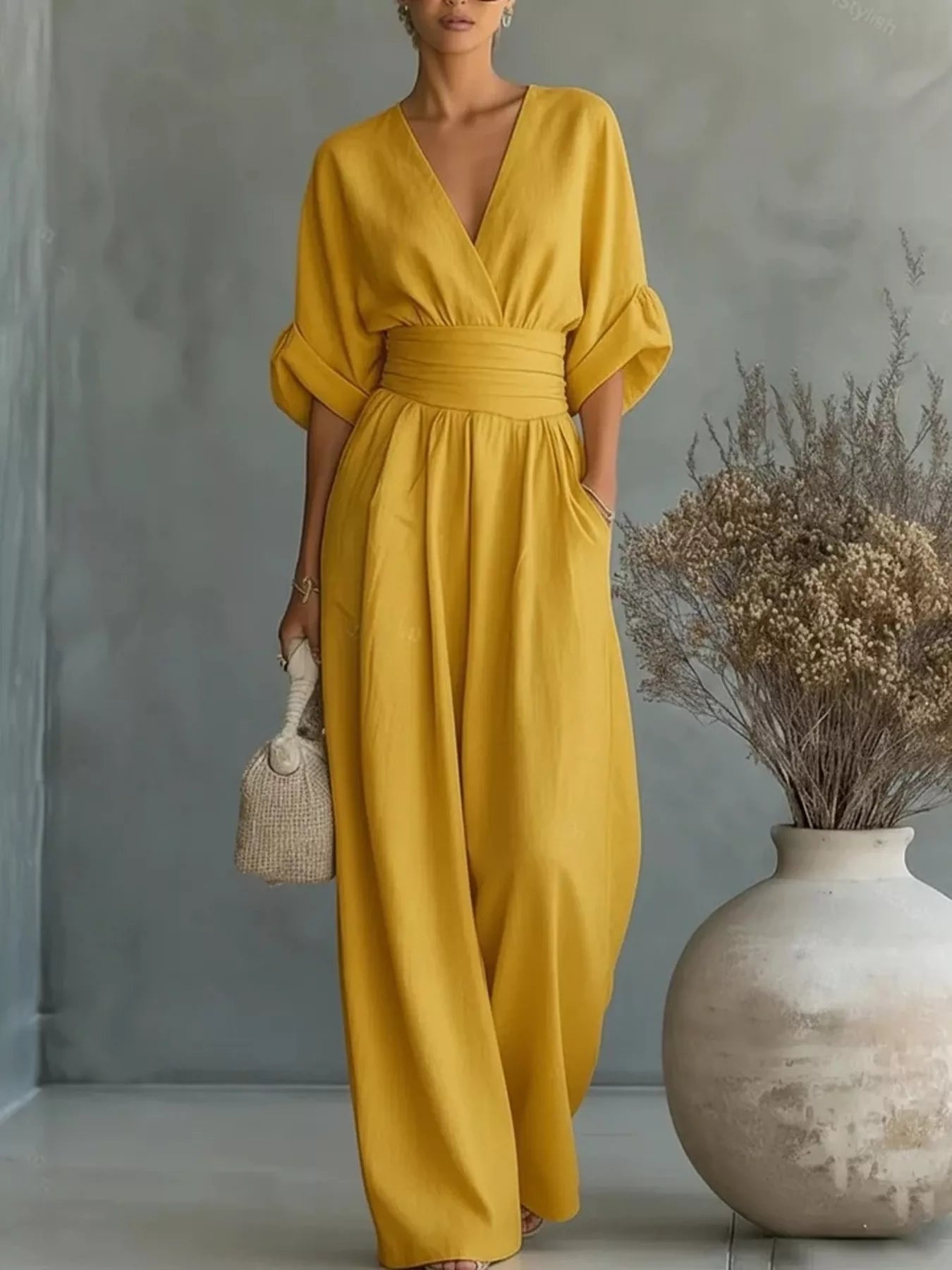 Yellow plus size jumpsuit with V-neck, half sleeves, elastic waist, flowy wide legs