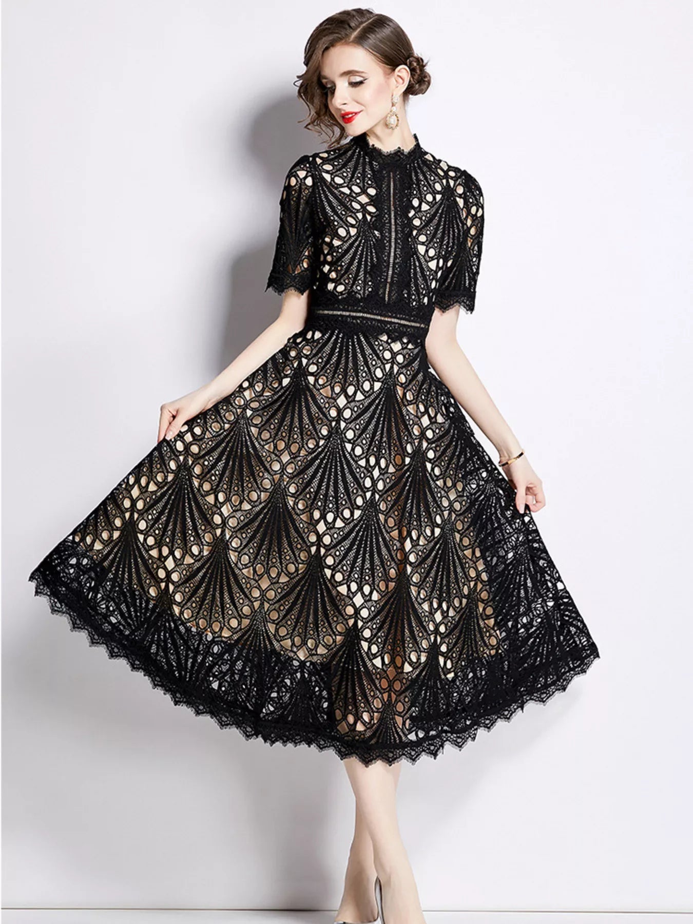 Plus-size lace short-sleeve midi dress in black with full flared skirt and lace motifs