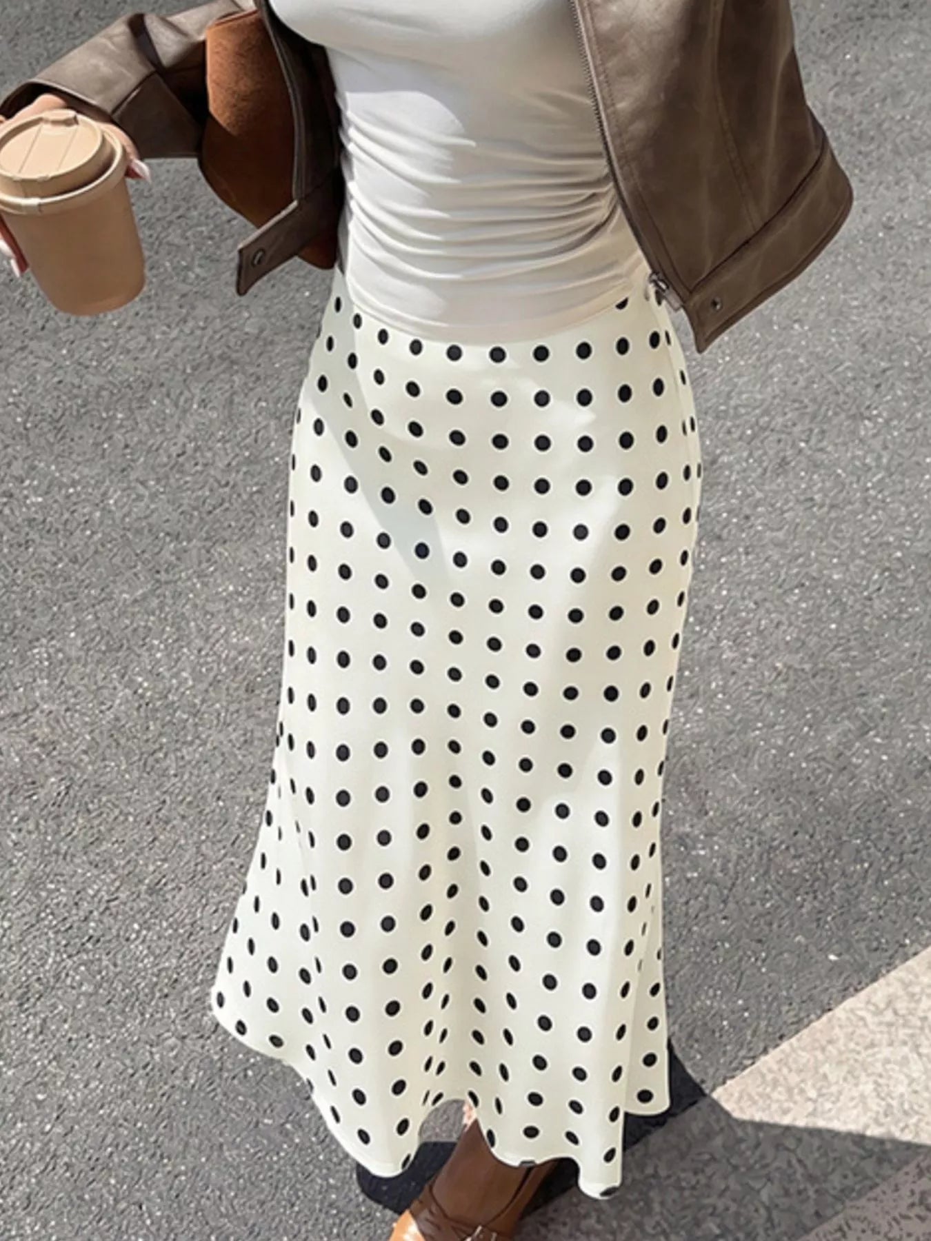 Cream polka dot midi skirt with black dots, high waist and flowing hemline