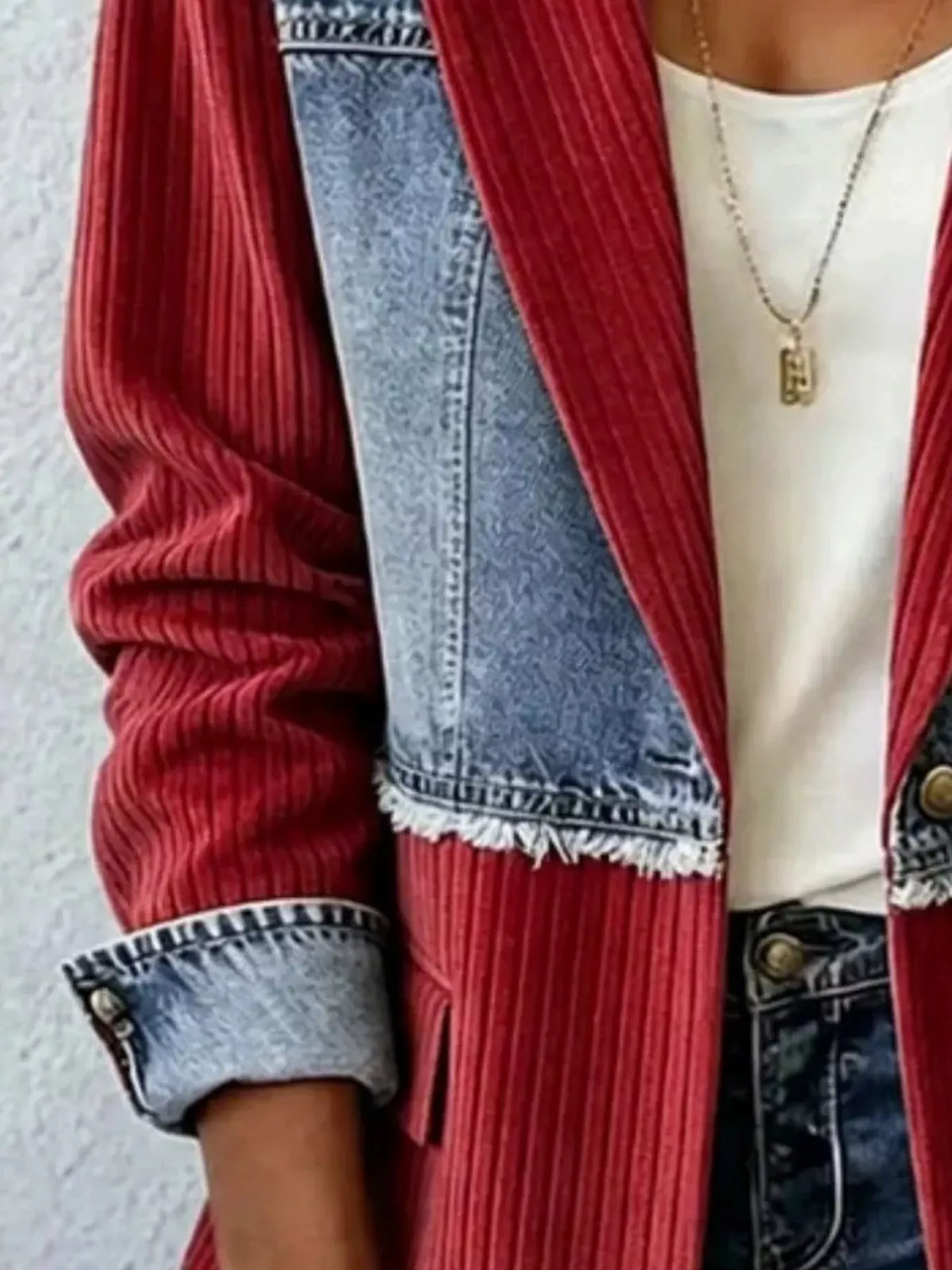 Patchwork ribbed blazer close-up: burgundy ribbed sleeves with denim panel and trim