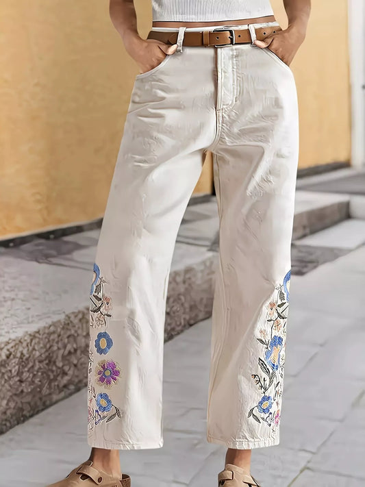 Off-white wide-leg jeans with floral embroidery on both legs and side seams