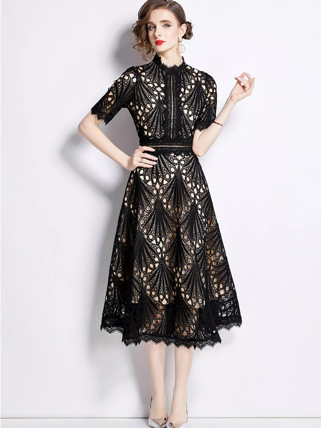 Plus-size lace short-sleeve midi dress in black with high neckline and flared skirt