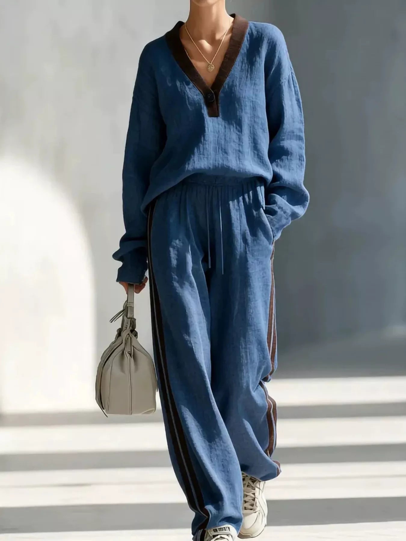 Navy V-neck top and striped jogger pants set with contrast trim, relaxed fit