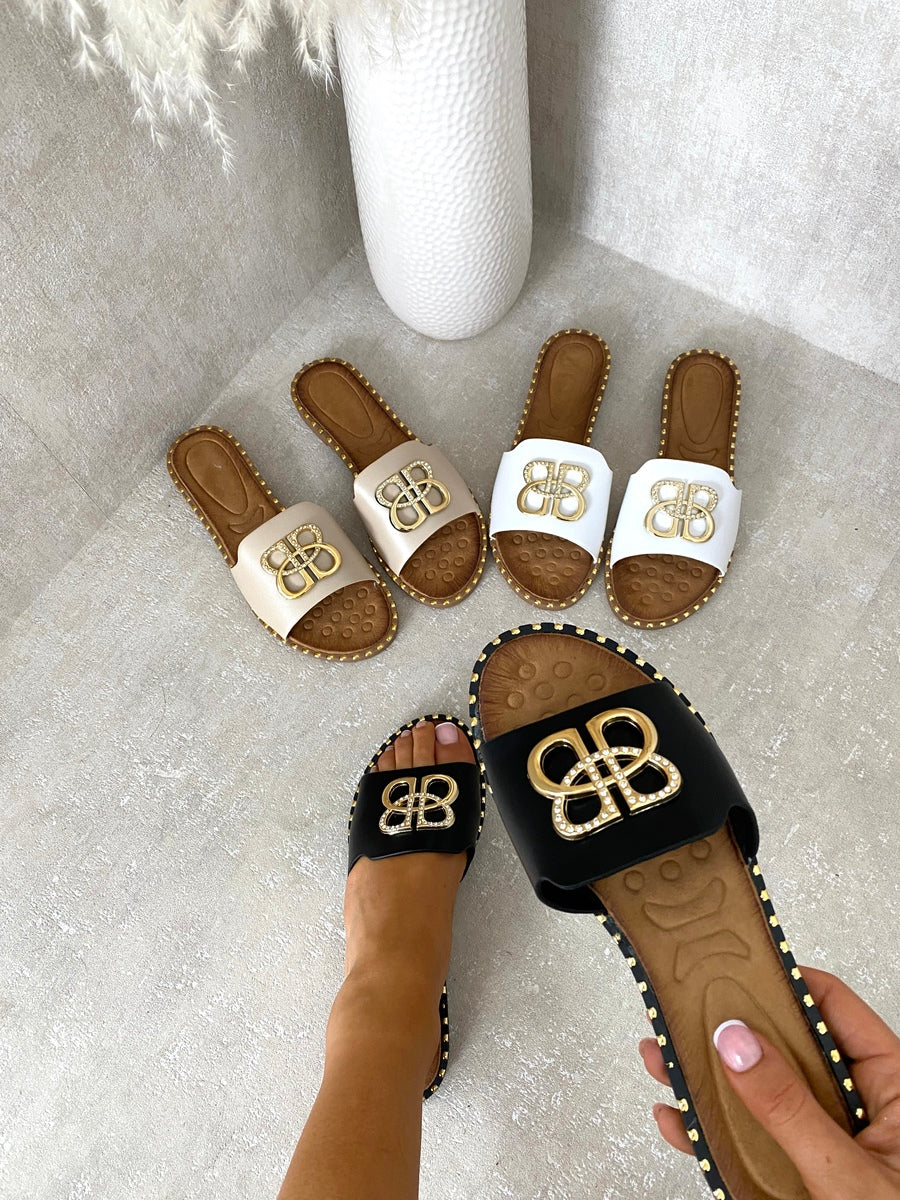 Assorted studded flat sandals with gold BB buckle emblem, open-toe slide
