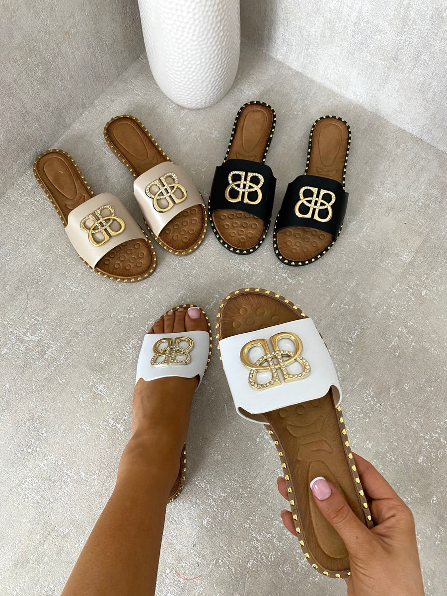 Flat sandals set in beige, black, and white with gold BB logo buckle