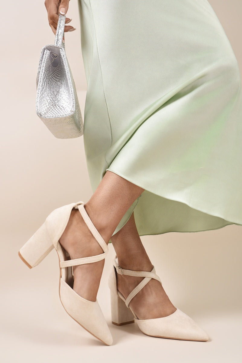 Beige cross-strap block heels with pointed toe, crisscross straps and chunky heel