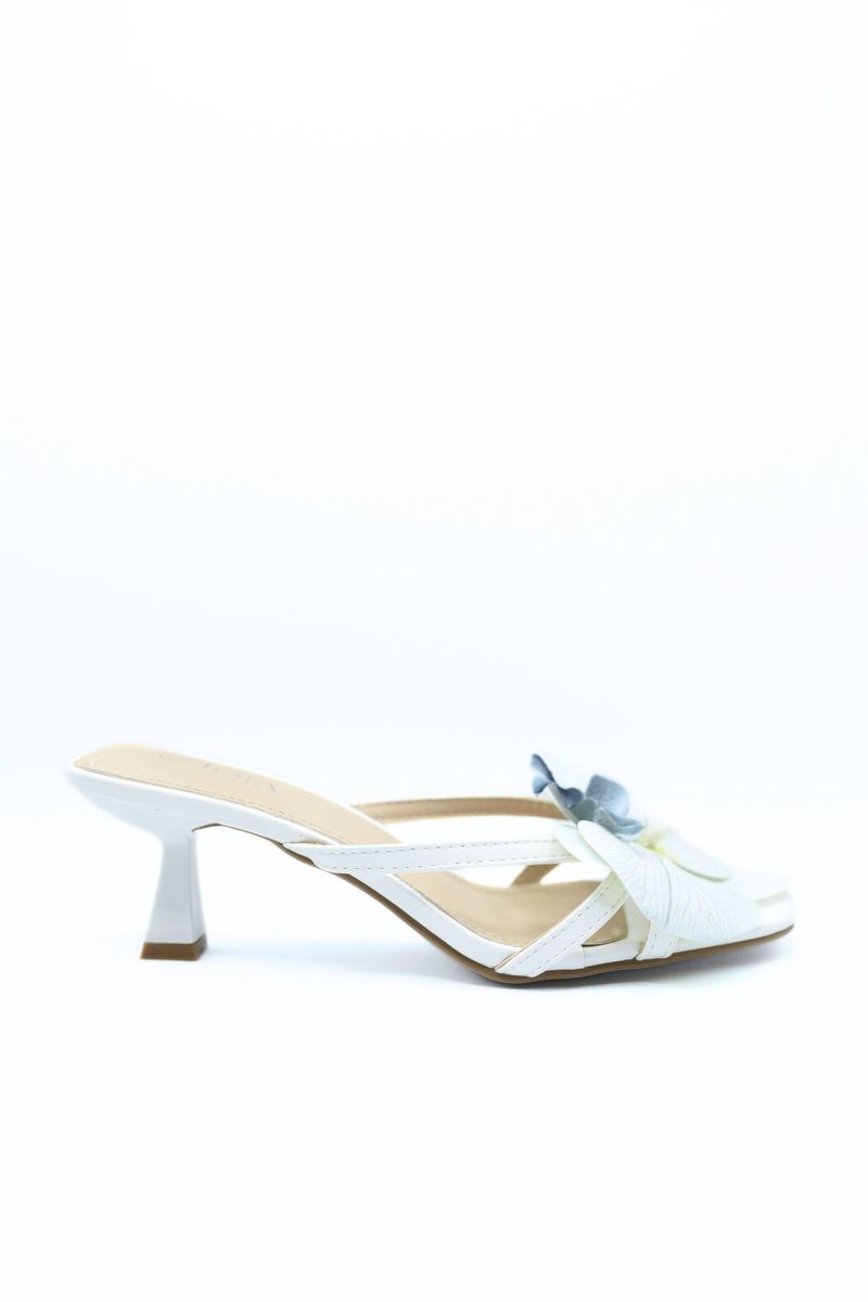 Cream high-heel slide sandal with blue orchid flower on the strap