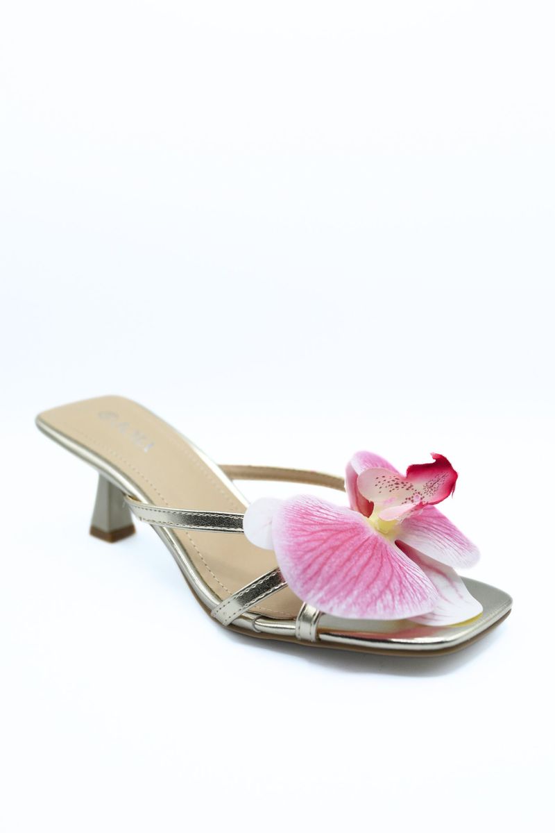 Floral strap high heel mule with large pink orchid flower and metallic strap, block heel.