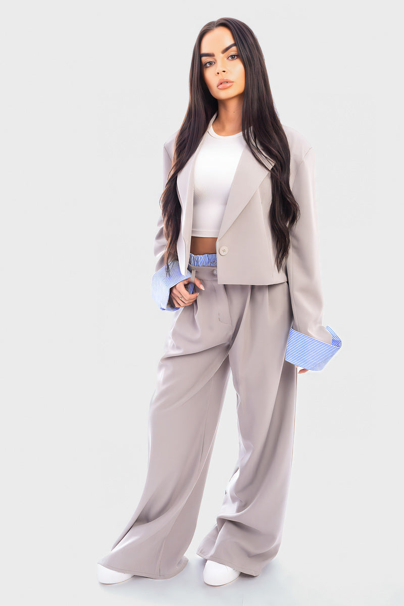 Light gray cropped blazer and straight-leg trousers with blue striped cuffs, open front