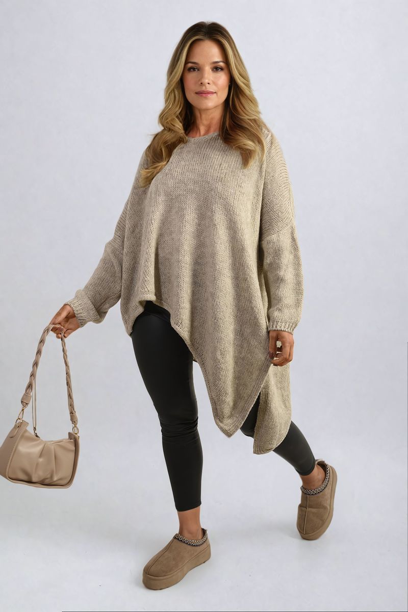 Front View: "Asymmetric Oversized Knitted Jumper in soft knit fabric, showcasing a relaxed and trendy fit."