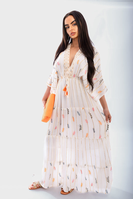 Cream V-neck tassel printed maxi dress with tiered skirt and embroidered neckline