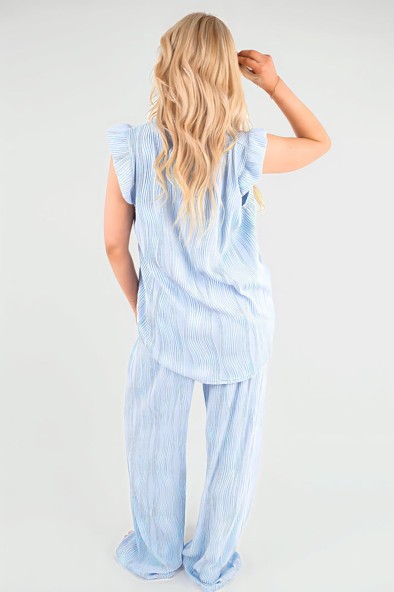Light blue textured frill-sleeve top and wide-leg trousers co-ord set, back view