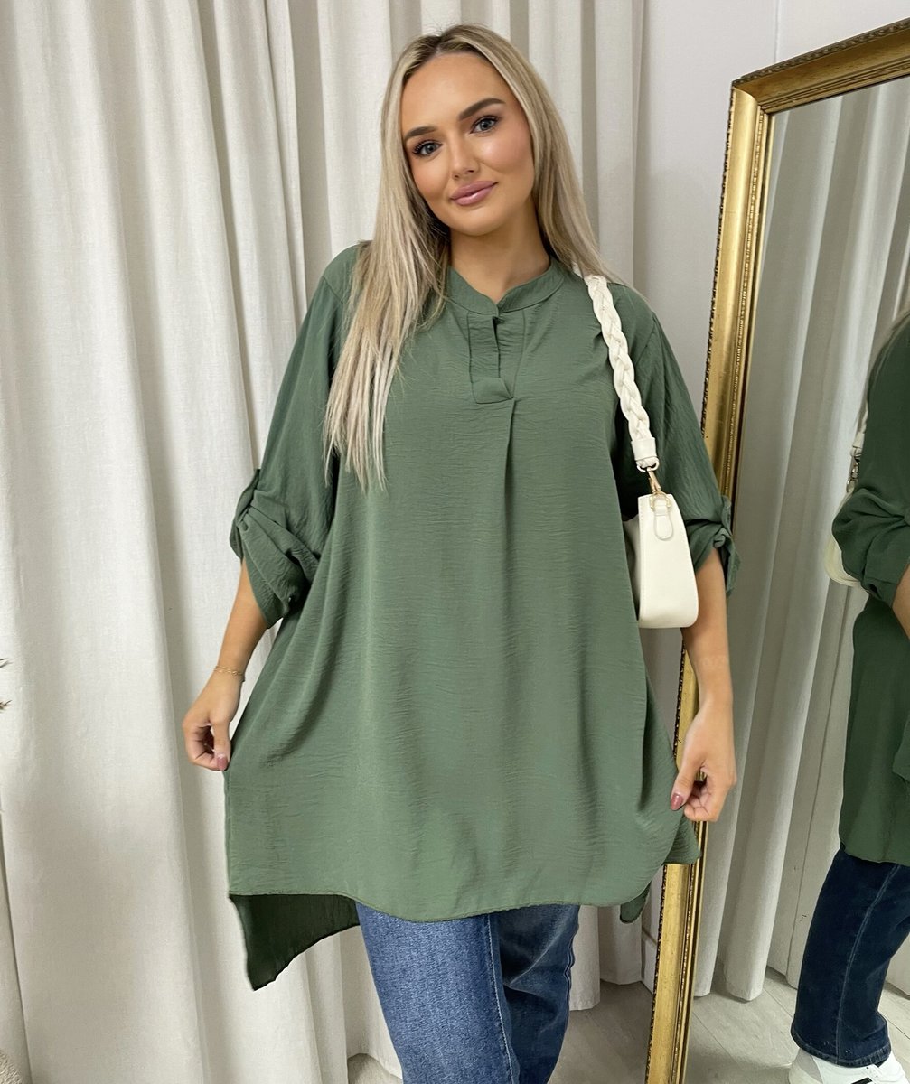 Loose-fit tunic top in dark green with rolled sleeves and front button placket