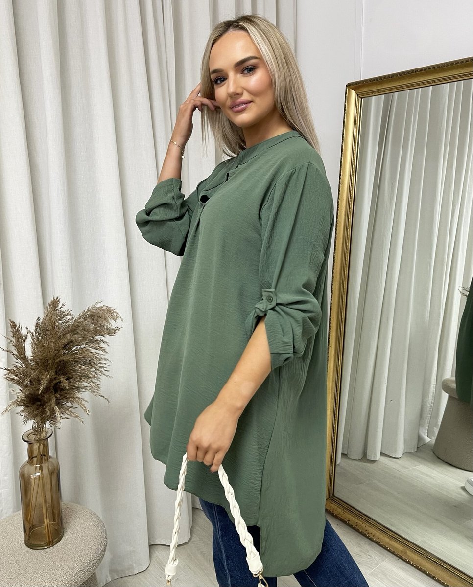 Loose-fit tunic top in dark green with roll-up sleeves and side tie detail