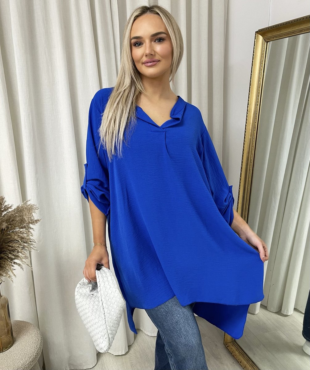 Loose-fit long-sleeve top in royal blue with roll-up sleeves and V neckline