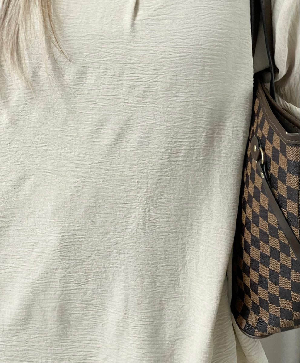 Cream long back loose-fit top with subtle textured fabric