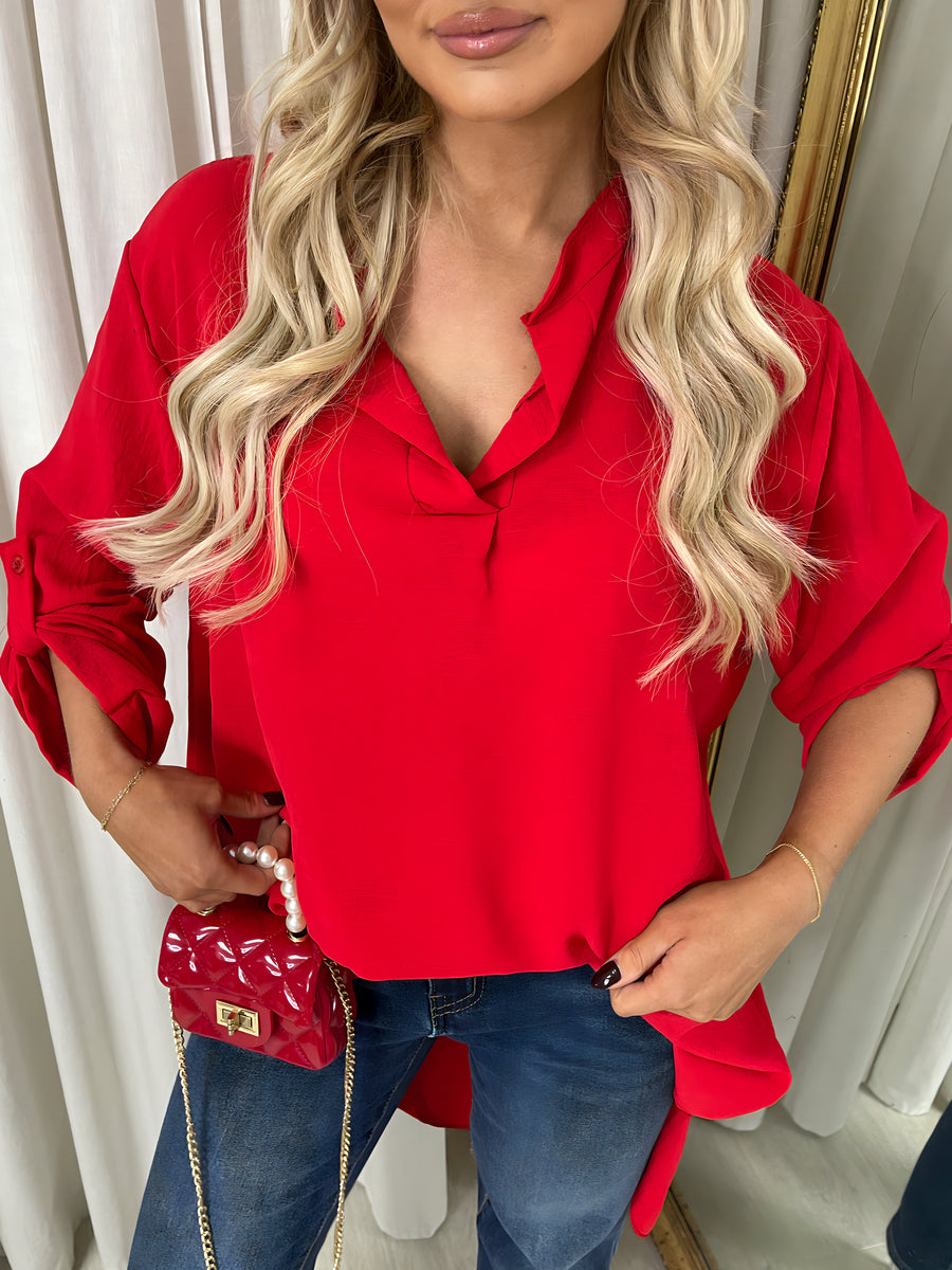 Red loose-fit V-neck blouse with roll-up sleeves and draped neckline
