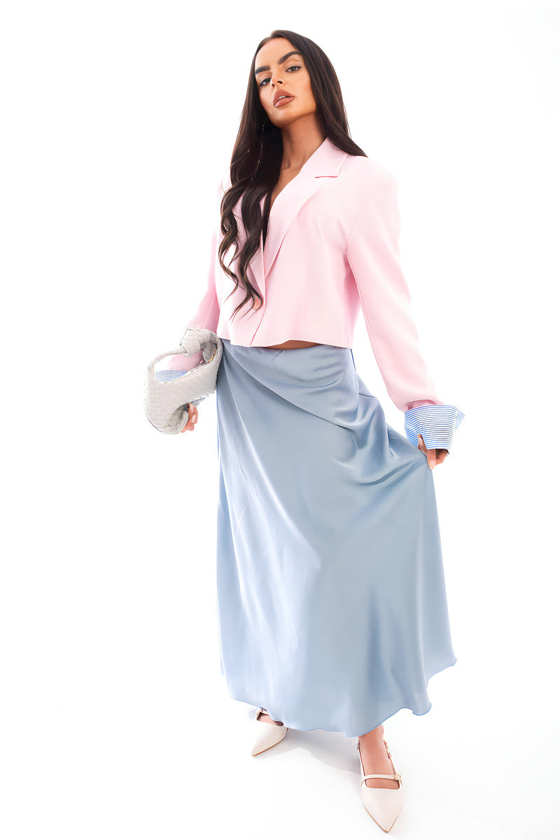 Light blue high-waisted maxi skirt with gathered waist and flowing maxi length