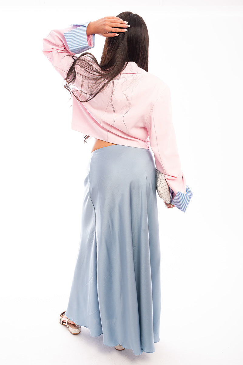 Light blue high-waisted maxi skirt with smooth fabric and flowing maxi length