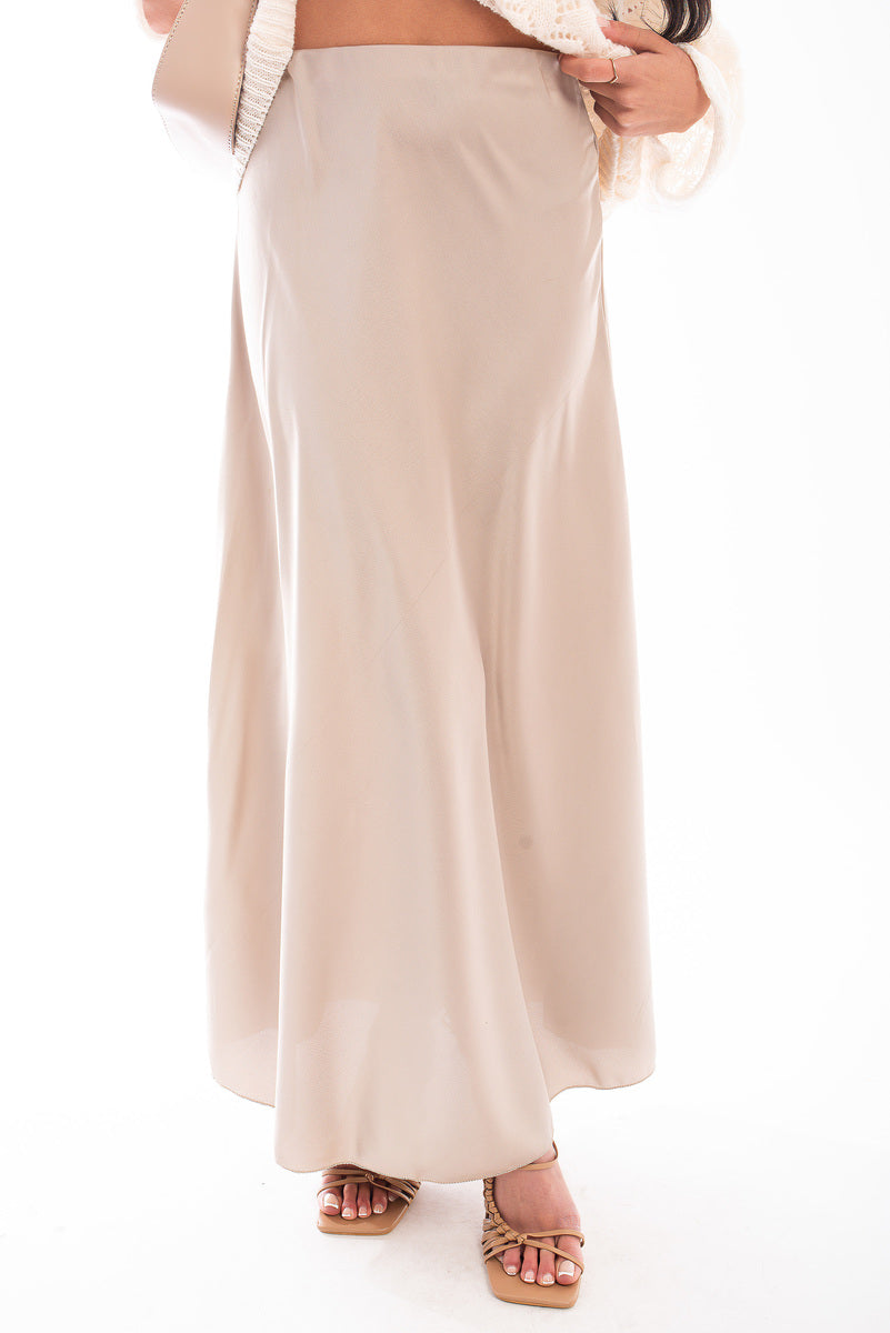 Beige high-waisted maxi skirt with smooth fabric and full-length hem
