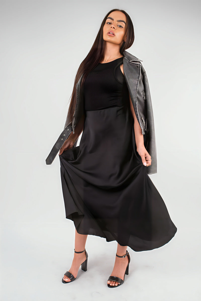 Black high-waisted maxi skirt with gathered drape and full-length, flared hem