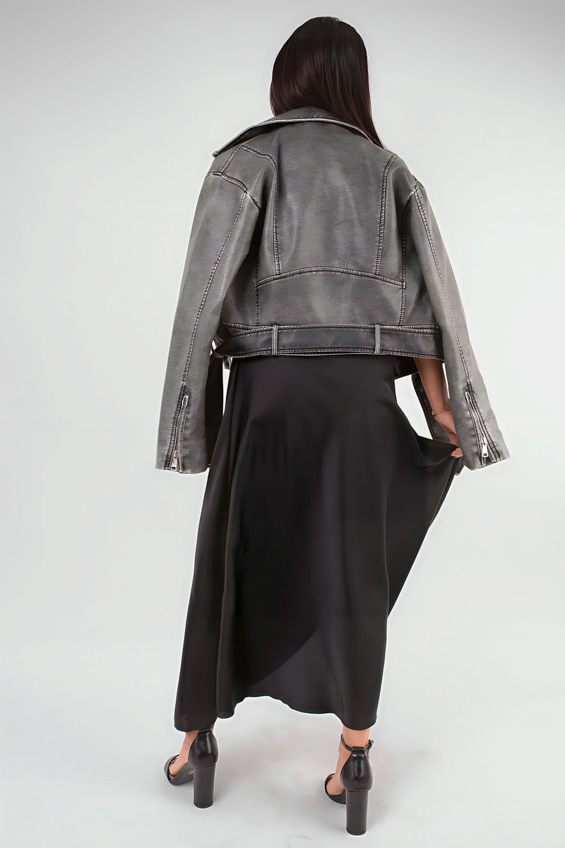 Back view of black high-waisted maxi skirt with draped fabric and midi-to-maxi length