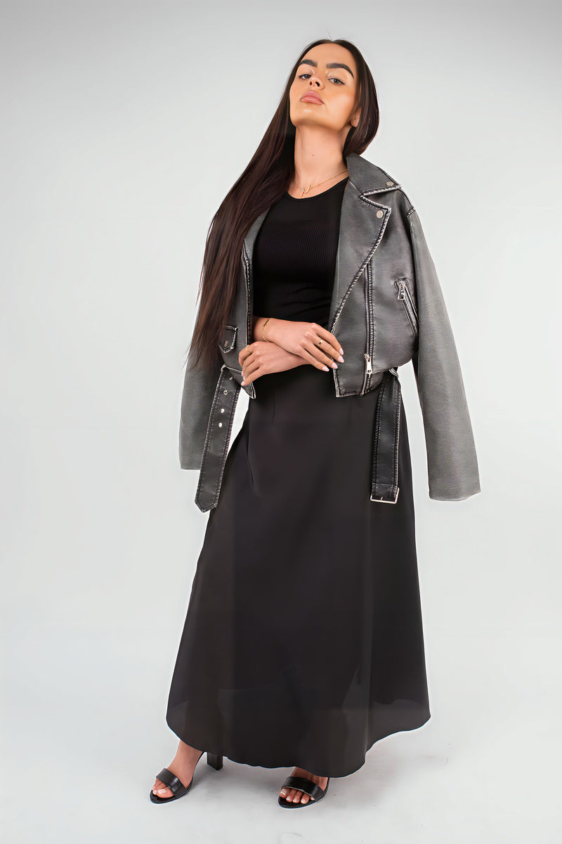 Black high-waisted maxi skirt with smooth drape and full-length flowing skirt