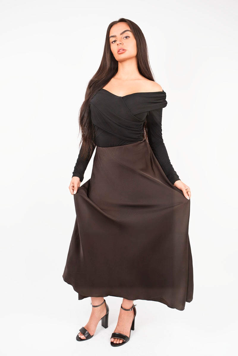 Chocolate-brown high-waisted maxi skirt with draped fabric and wide waistband