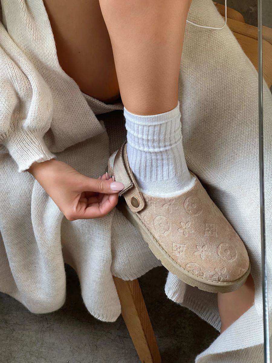 Beige printed sling-back platform clog with ankle strap and rounded toe.