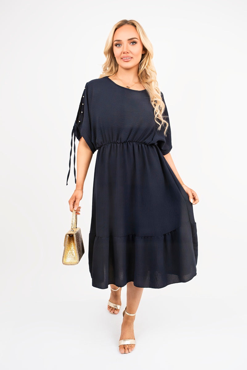 Navy round-neck midi dress with short sleeves, tie detail, tiered skirt