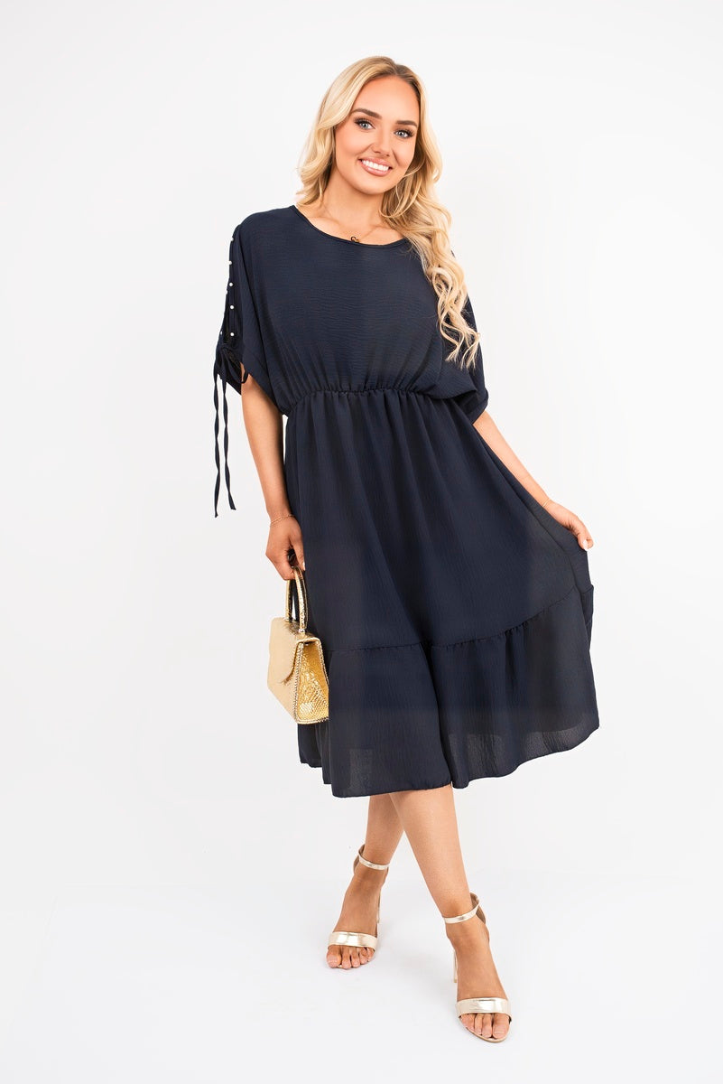 Navy round-neck midi dress with short sleeves and tied cuffs, tiered hem