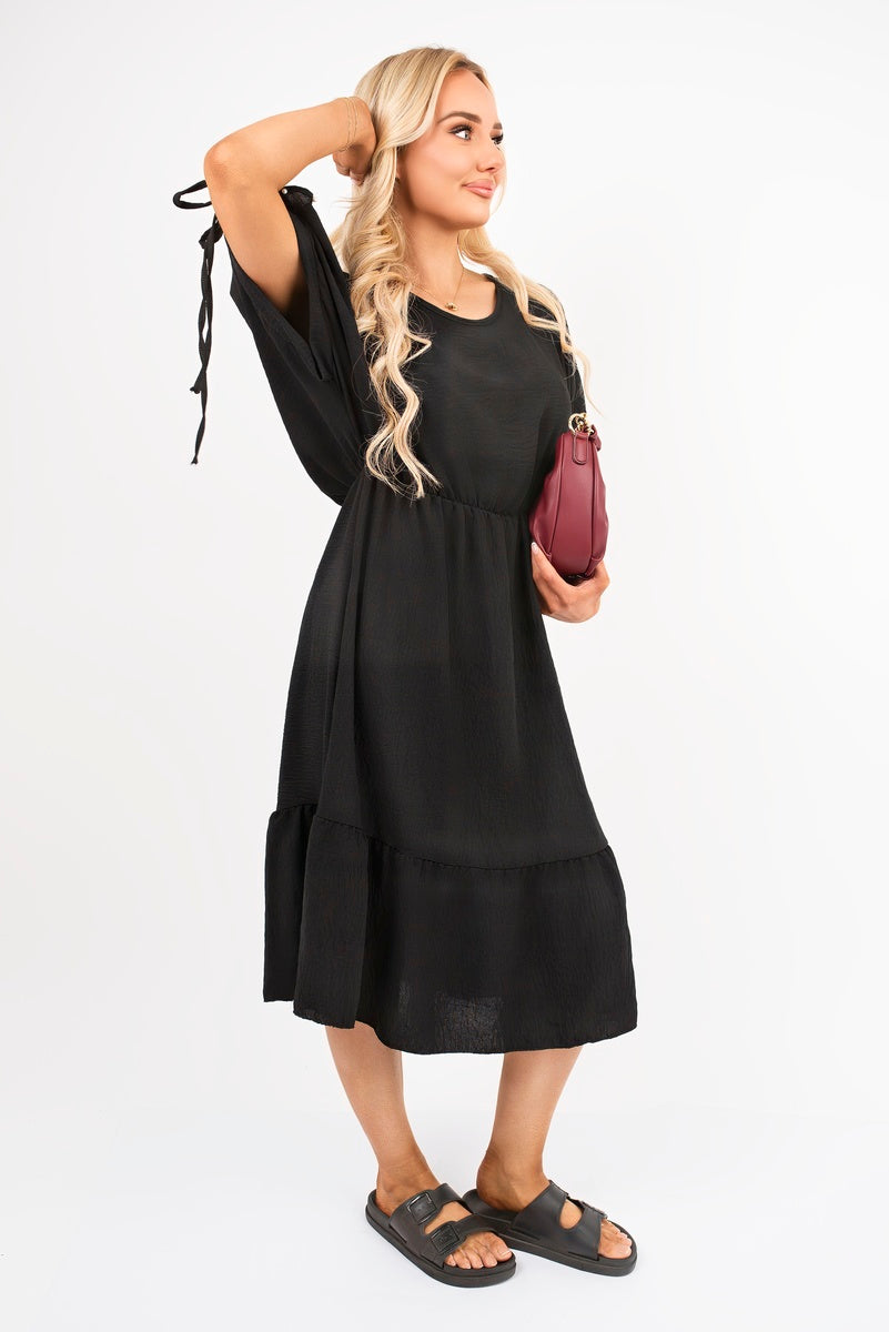 Black round neck midi dress with tie sleeves, gathered waist and tiered midi skirt