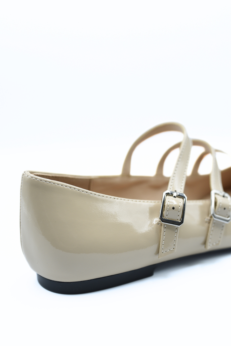 Beige strappy flat shoes with square buckle detail on ankle straps